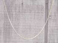 Long thin chain forming a catenary.